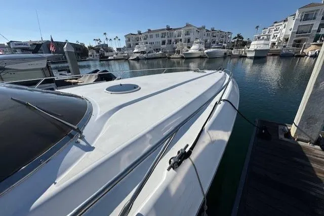 Slide: The Image of 1994 Sunseeker Apache 45 docked in a marina with luxury yachts. - 4