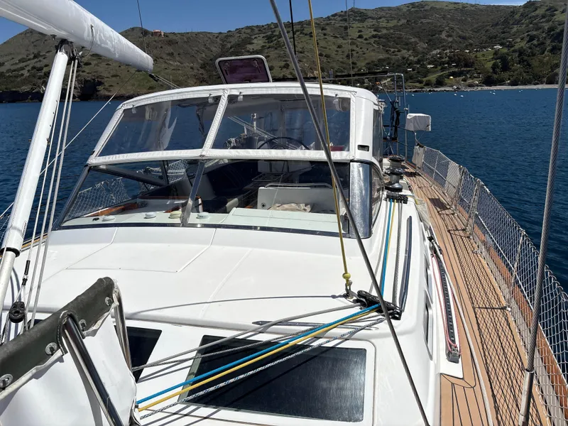 Slide: The Image of Beneteau 57 sailboat, 2005 model, docked in scenic bay with clear blue water. - 19