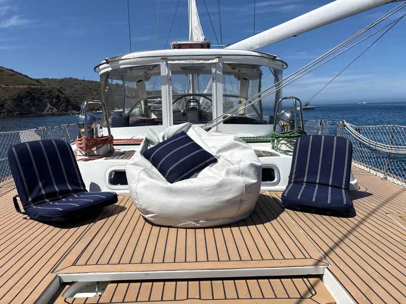 Slide: The Image of Deck of 2005 Beneteau 57 yacht with seating and ocean view. - 21