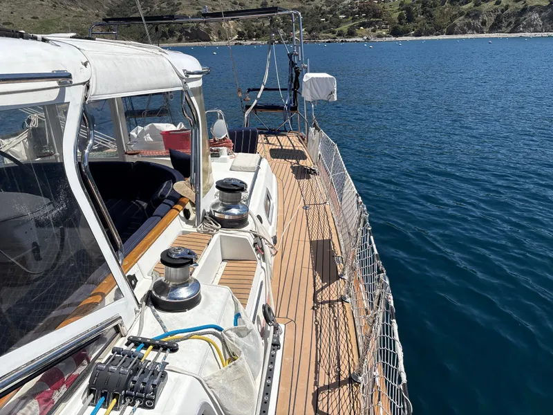 Slide: The Image of Beneteau 57 sailboat deck, 2005 model, with ocean view and clear skies. - 25