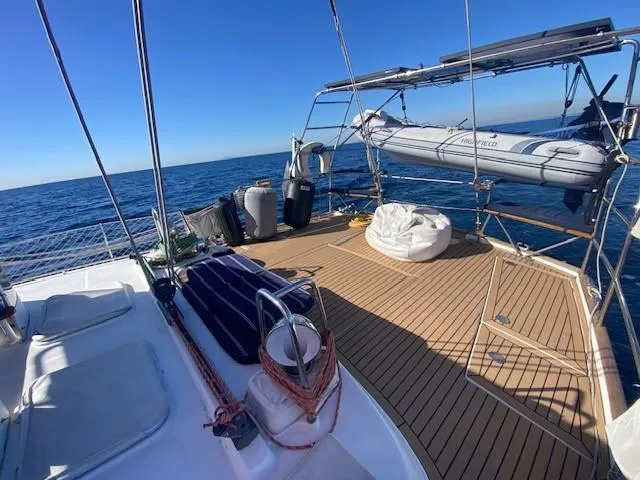 Slide: The Image of Beneteau 57 sailboat deck, 2005 model, with ocean view and clear blue sky. - 39