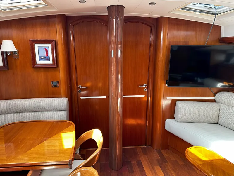 Slide: The Image of Luxurious 2005 Beneteau 57 yacht interior with wood finish and modern amenities. - 40