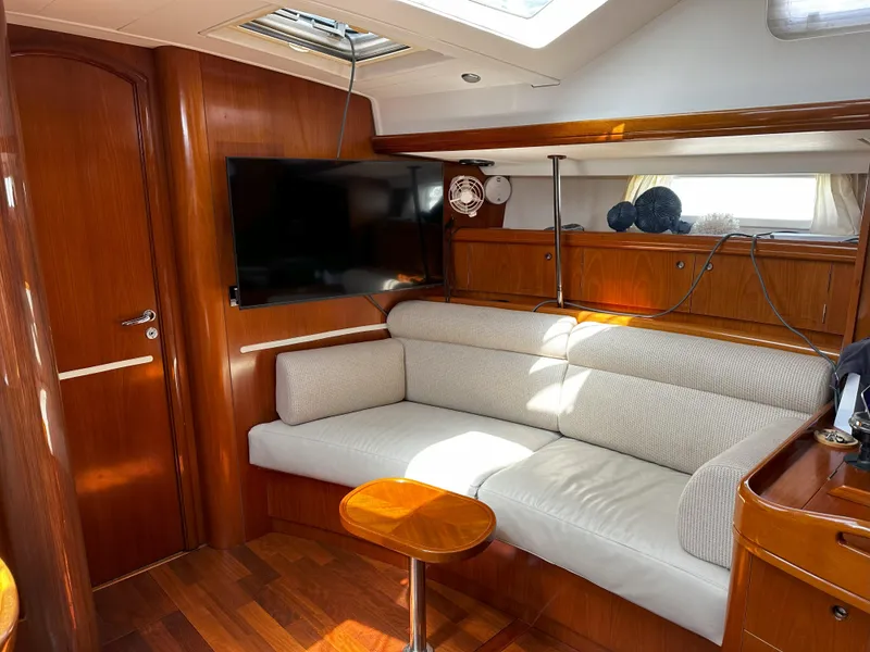 Slide: The Image of Luxurious interior of 2005 Beneteau 57 yacht with plush seating and modern amenities. - 45