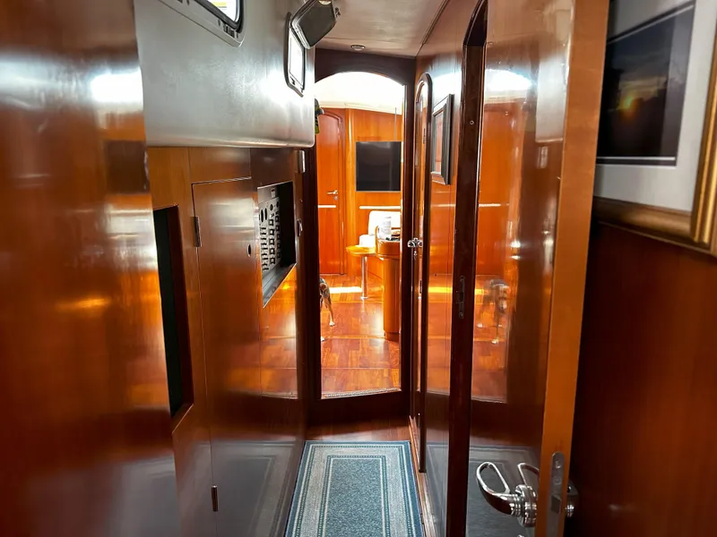 Slide: The Image of Interior of 2005 Beneteau 57 yacht with polished wood finish and modern design. - 48