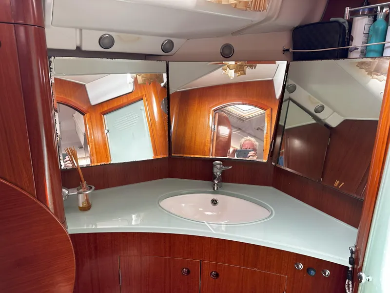 Slide: The Image of Luxurious Beneteau 57 yacht bathroom with wood accents and modern fixtures, 2005 model. - 49