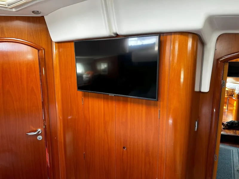 Slide: The Image of Interior of 2005 Beneteau 57 yacht with mounted flat-screen TV. - 51