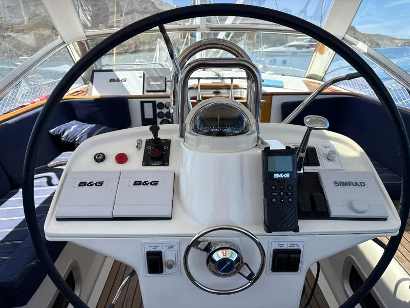 Slide: The Image of Cockpit of 2005 Beneteau 57 yacht with navigation equipment and steering wheel. - 6