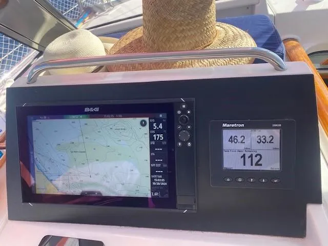 Slide: The Image of Navigation system on a 2005 Beneteau 57 yacht with straw hats nearby. - 7