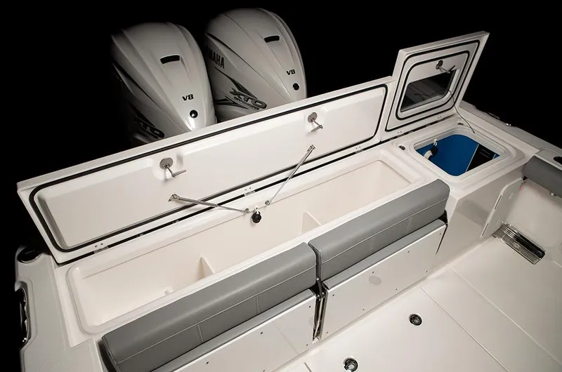 Slide: The Image of Manufacturer Provided Image: 2025 Everglades 335 Center Console boat interior with storage and dual Yamaha V8 engines. - 10