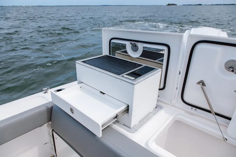 Slide: The Image of Outdoor kitchen on 2026 Everglades 395 Center Console boat, featuring grill and storage. - 14