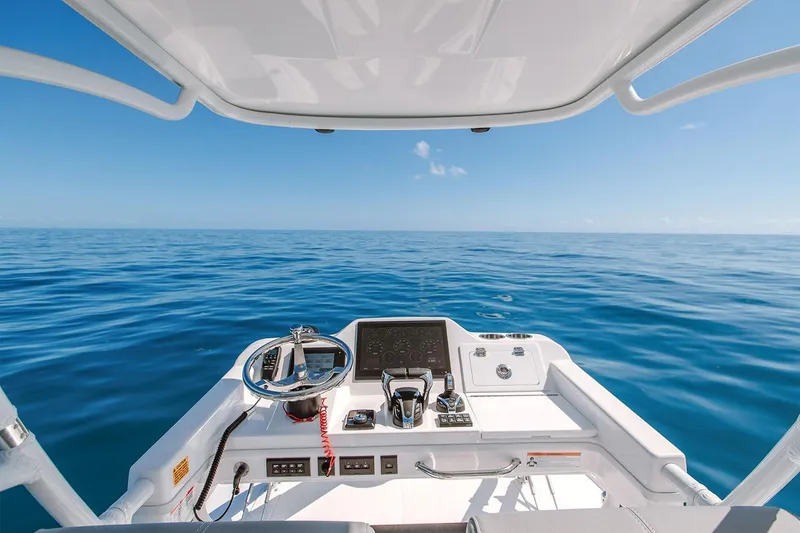 Slide: The Image of Manufacturer Provided Image: 2025 Everglades 395 Center Console boat on open sea, clear blue sky. - 4