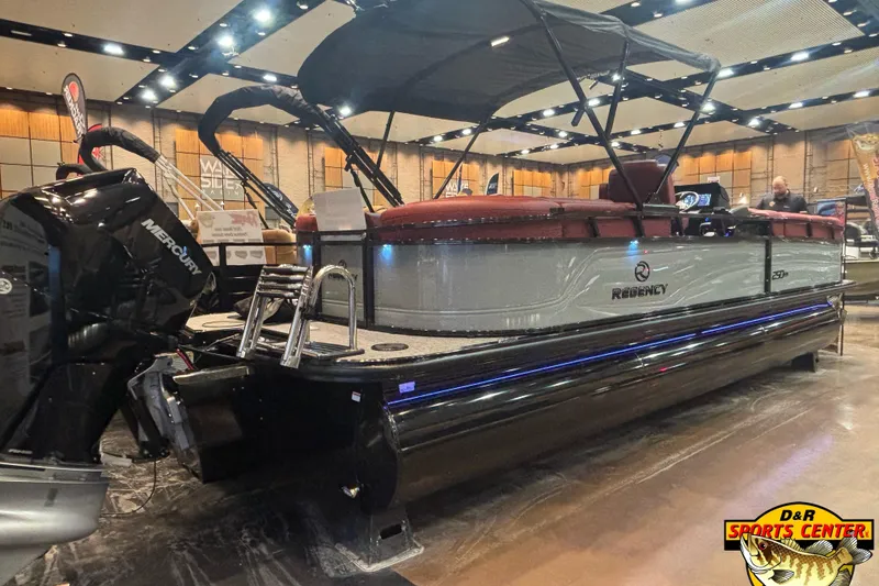 Slide: The Image of Luxurious red seating on 2026 Regency 250 DL pontoon boat display. - 7