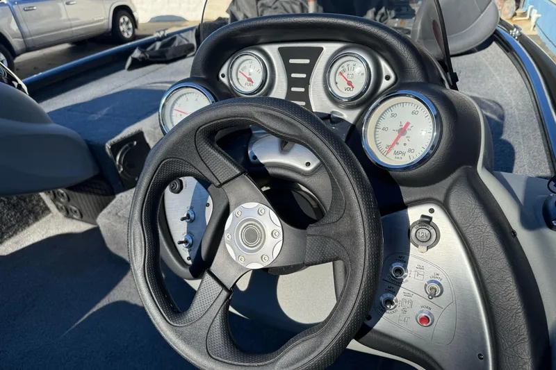 Slide: The Image of Steering console of 2017 Tracker Pro Team 195 TXW boat with gauges and controls. - 12