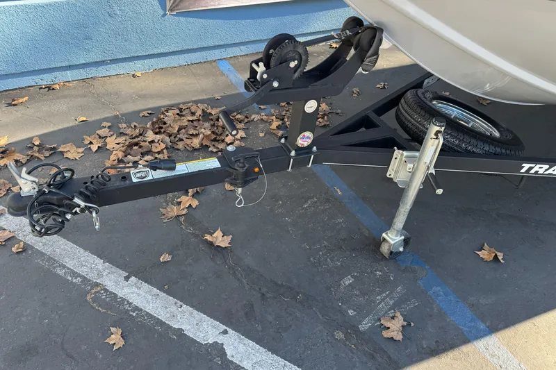 Slide: The Image of Trailer hitch of a 2017 Tracker Pro Team 195 TXW boat, parked with fallen leaves. - 3