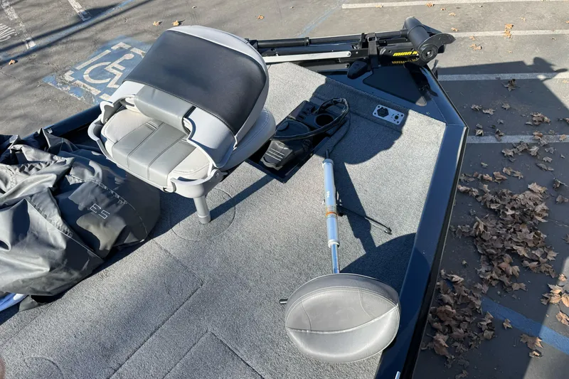 Slide: The Image of 2017 Tracker Pro Team 195 TXW boat interior with seat and equipment on deck. - 7