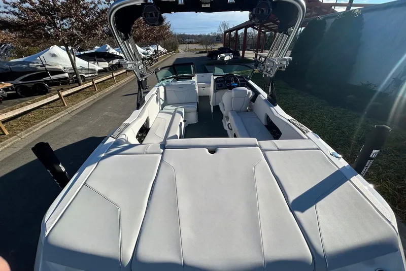 Slide: The Image of 2020 MasterCraft NXT22 boat interior with spacious seating and modern design. - 10