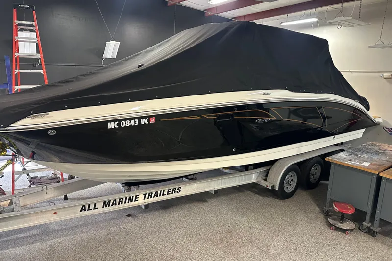 The Image of 2015 Sea Ray 290 Sundeck boat on trailer, covered, in indoor storage. - 0