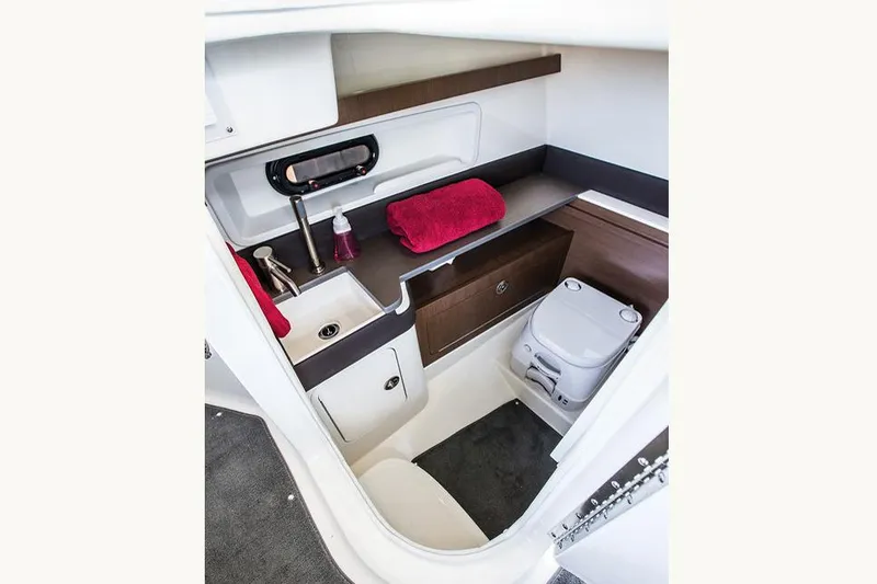Slide: The Image of Manufacturer Provided Image: 2015 Sea Ray 290 Sundeck interior cabin with sink and toilet. - 17