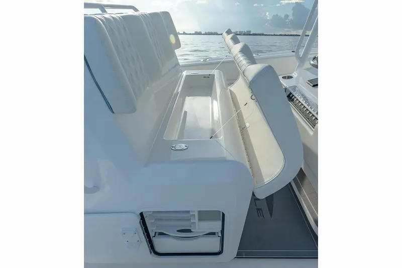 Slide: The Image of Manufacturer Provided Image: 2026 Invincible 33 Catamaran interior seating with storage, showcasing sleek design and functionality. - 11