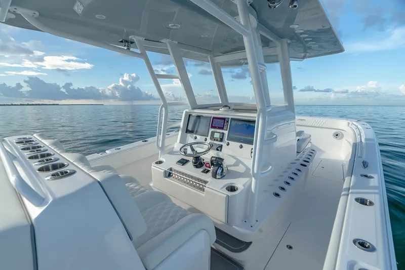 Slide: The Image of Manufacturer Provided Image: 2026 Invincible 33 Catamaran on calm ocean, featuring modern helm and seating. - 12