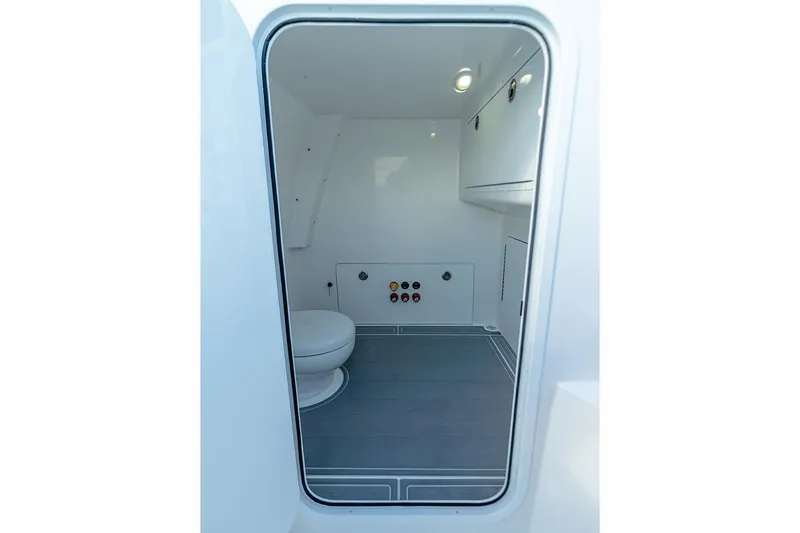 Slide: The Image of Manufacturer Provided Image: Interior of 2026 Invincible 33 Catamaran, featuring a compact, modern marine bathroom. - 16