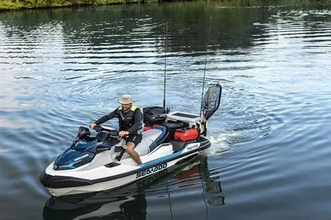 Slide: The Image of 2026 Sea-Doo FishPro Sport 170 jet ski on a calm lake, equipped for fishing. - 3