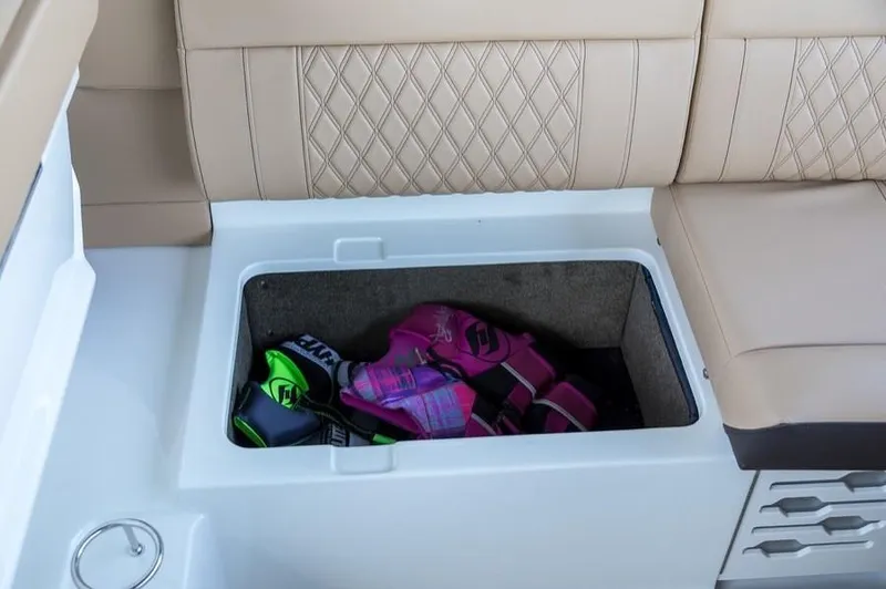 Slide: The Image of Manufacturer Provided Image: 2019 Sea Ray SLX 280 storage compartment with life jackets. - 23
