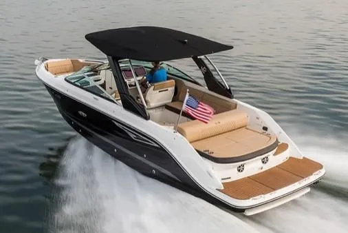 Slide: The Image of Manufacturer Provided Image: 2019 Sea Ray SLX 280 boat cruising on water with American flag. - 24