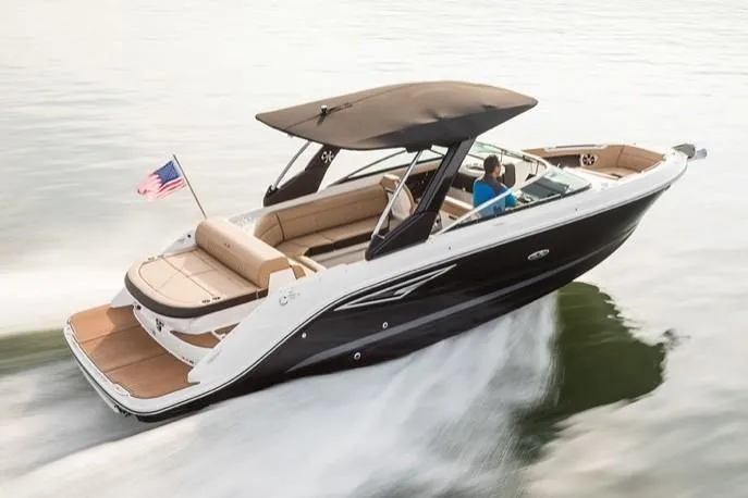 Slide: The Image of Manufacturer Provided Image: 2019 Sea Ray SLX 280 boat cruising on water with American flag. - 26