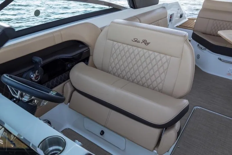 Slide: The Image of Manufacturer Provided Image: 2019 Sea Ray SLX 280 boat interior with beige leather seating. - 4