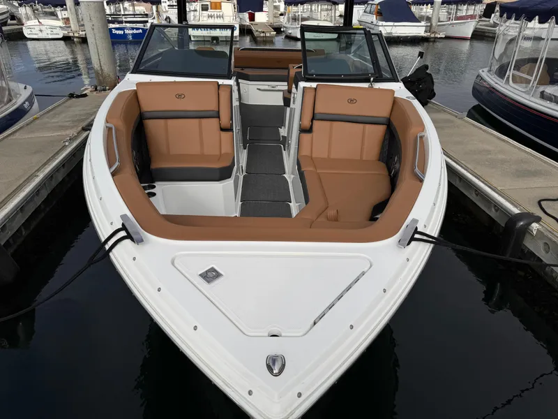 Slide: The Image of 2022 Cobalt R8 boat with tan seating docked at marina. - 18