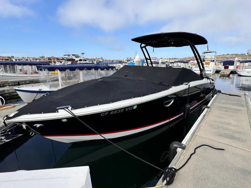 Slide: The Image of 2022 Cobalt R8 boat docked at marina, covered and ready for use. - 20
