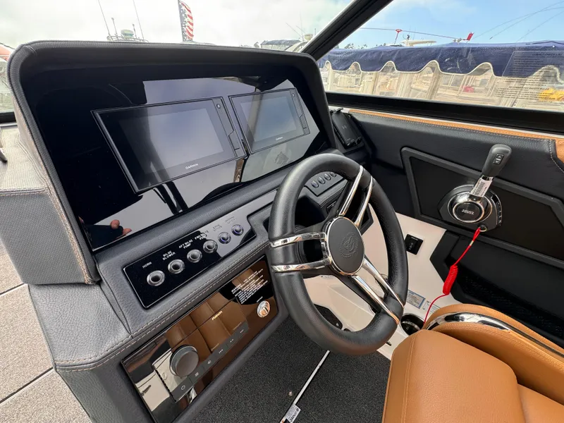 Slide: The Image of Interior of 2022 Cobalt R8 boat with modern dashboard and steering wheel. - 9