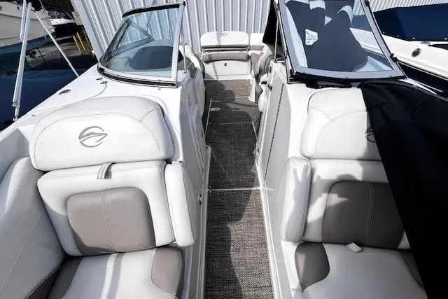 Slide: The Image of 2018 Crownline 275 SS boat interior with white and gray seating. - 15