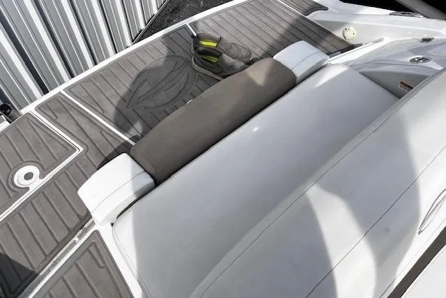 Slide: The Image of 2018 Crownline 275 SS boat interior with cushioned seating and deck details. - 17