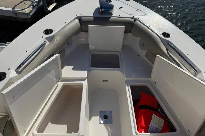 Slide: The Image of 2023 Key West 239 DFS boat interior with open storage compartments. - 11