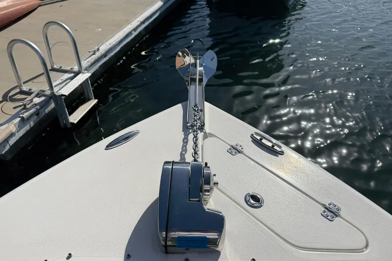 Slide: The Image of 2023 Key West 239 DFS boat bow with anchor and winch at dockside. - 12