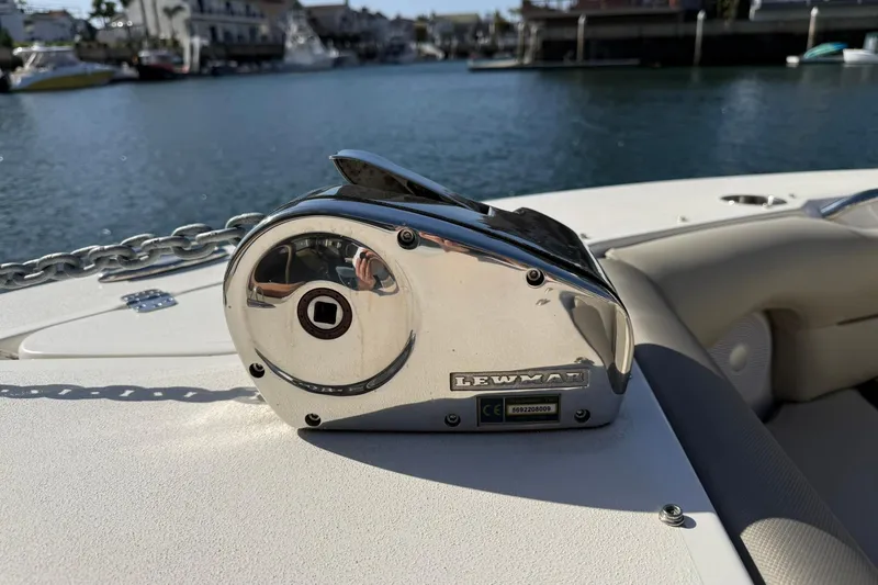 Slide: The Image of 2023 Key West 239 DFS boat with Lewmar windlass, docked in a marina. - 14