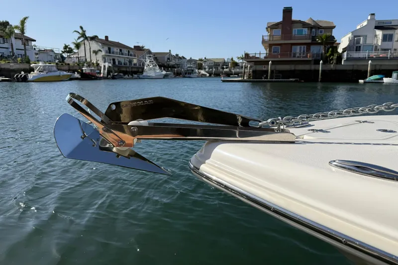 Slide: The Image of 2023 Key West 239 DFS boat with anchor in scenic harbor setting. - 15
