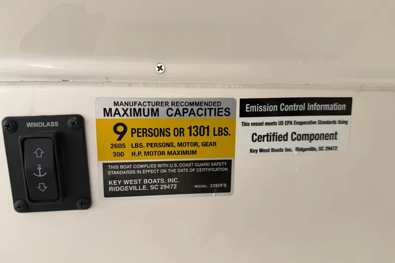 Slide: The Image of 2023 Key West 239 DFS capacity label, showing maximum 9 persons or 1301 lbs. - 22