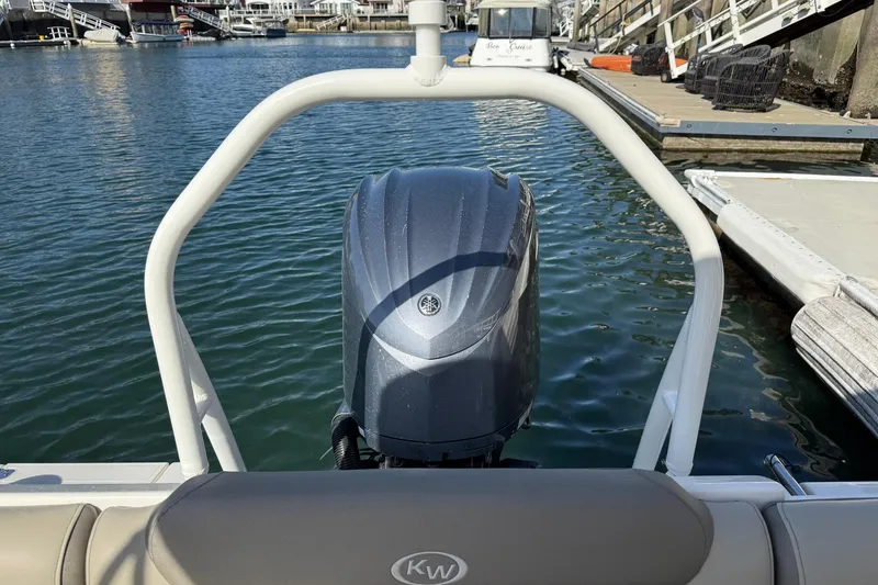 Slide: The Image of 2023 Key West 239 DFS boat with Yamaha outboard engine at a marina dock. - 30