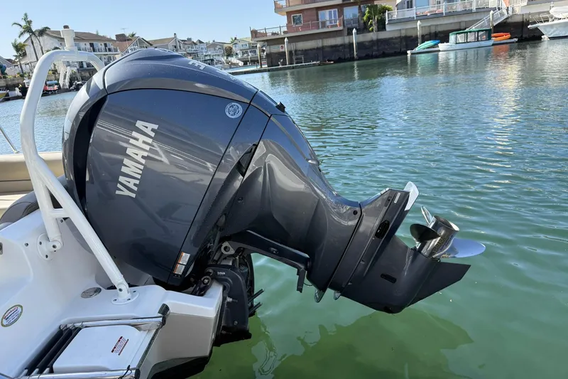 Slide: The Image of 2023 Key West 239 DFS with Yamaha outboard motor on calm water. - 31