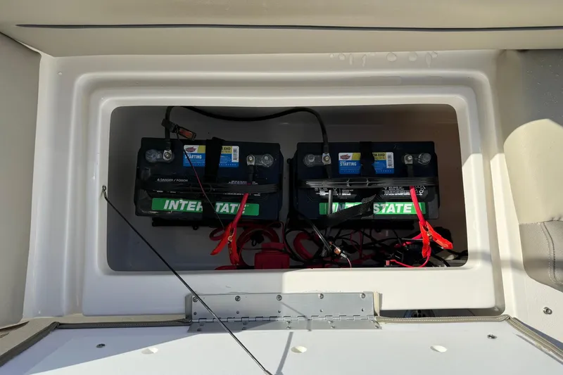 Slide: The Image of 2023 Key West 239 DFS boat battery compartment with dual Interstate batteries. - 36