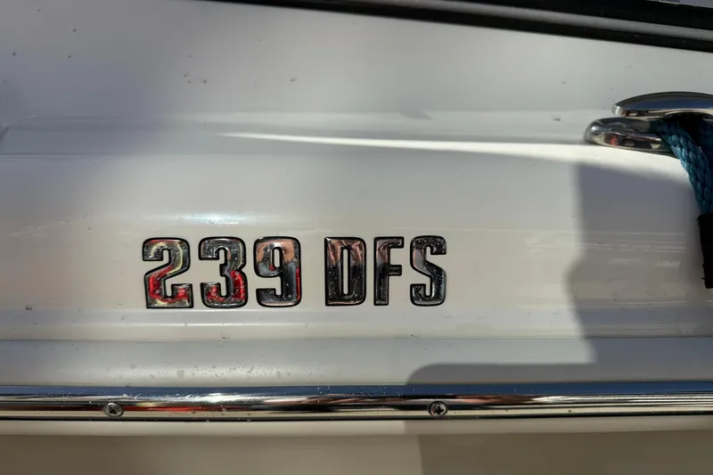 Slide: The Image of Close-up of 2023 Key West 239 DFS boat model emblem on white surface. - 5
