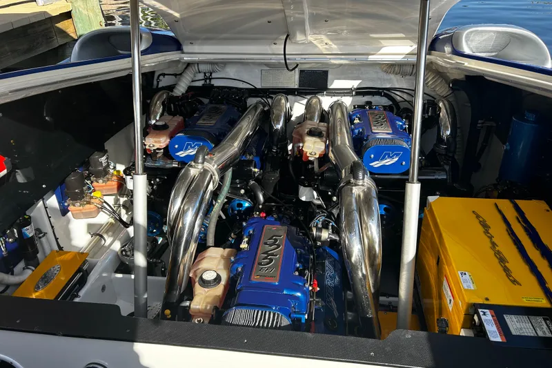 Slide: The Image of Engine compartment of a 2008 Nor-Tech 4300V boat, featuring powerful dual engines. - 4