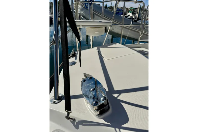 Slide: The Image of 2005 Catalina 42 MkII yacht deck with cleat and railing in marina. - 11