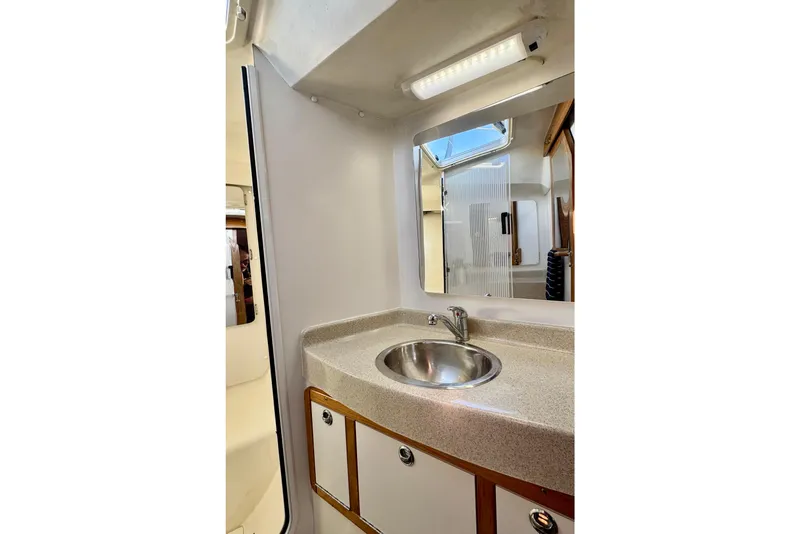 Slide: The Image of Interior of 2005 Catalina 42 MkII yacht bathroom with sink and mirror. - 29