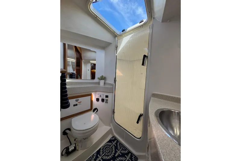 Slide: The Image of Bathroom interior of 2005 Catalina 42 MkII yacht with skylight and modern fixtures. - 30