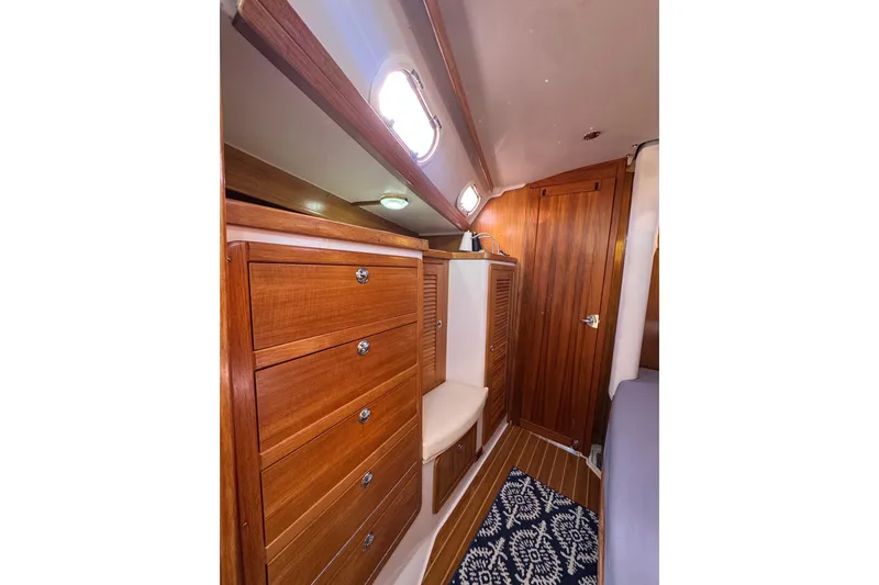 Slide: The Image of Interior of 2005 Catalina 42 MkII sailboat with wooden cabinetry and nautical decor. - 33