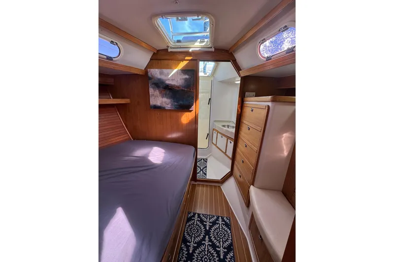 Slide: The Image of Interior of 2005 Catalina 42 MkII sailboat with cozy cabin and wooden furnishings. - 34